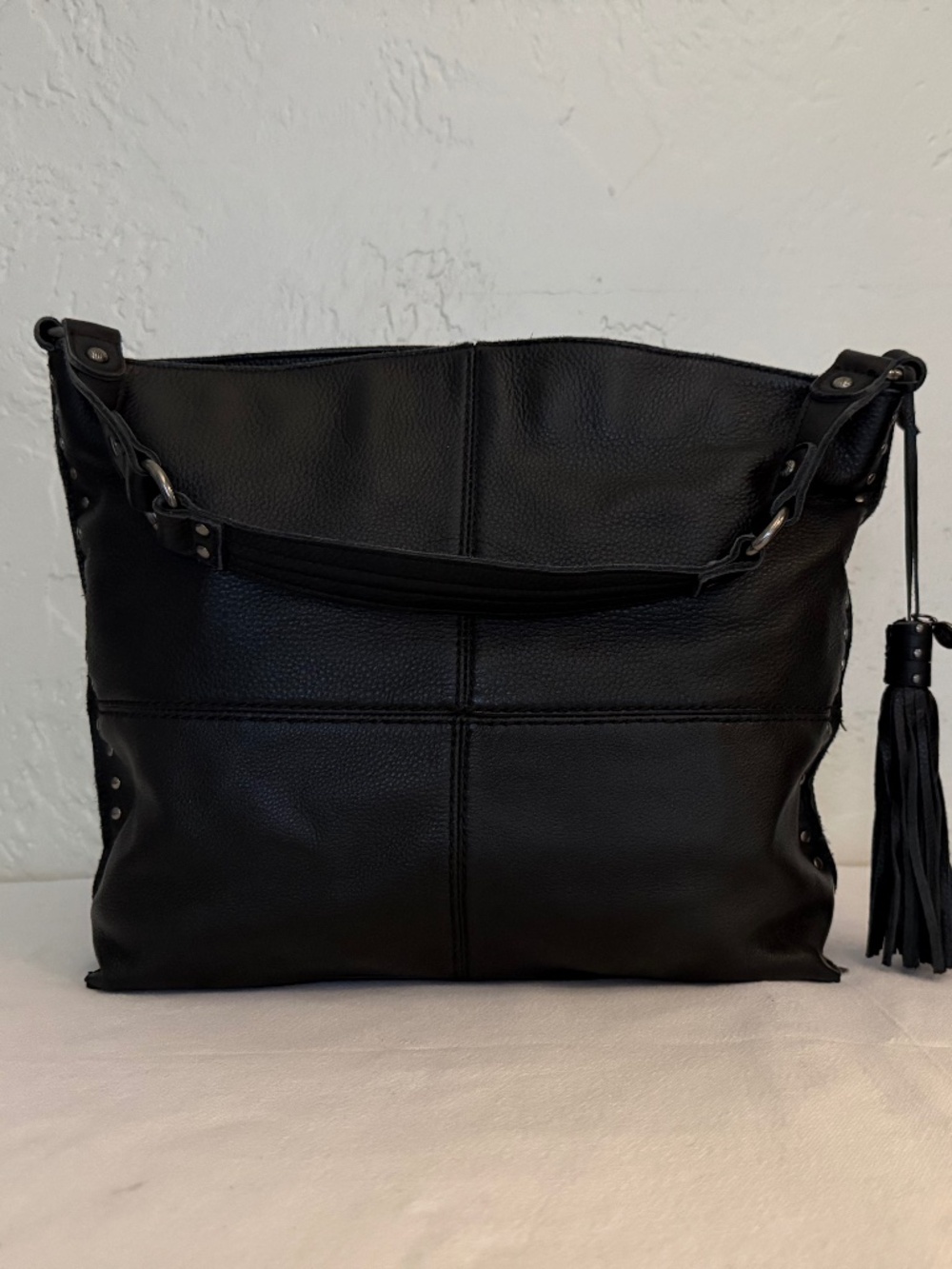 The Sak Black Pebbled Leather Studded Hobo Shoulder Bag Tassel